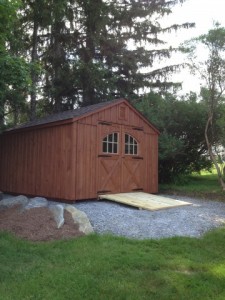 Slideshow Image - Board and Batten on Gravel Base with optional Cedar Stain, Strap Hinges and Carriage Style doors.